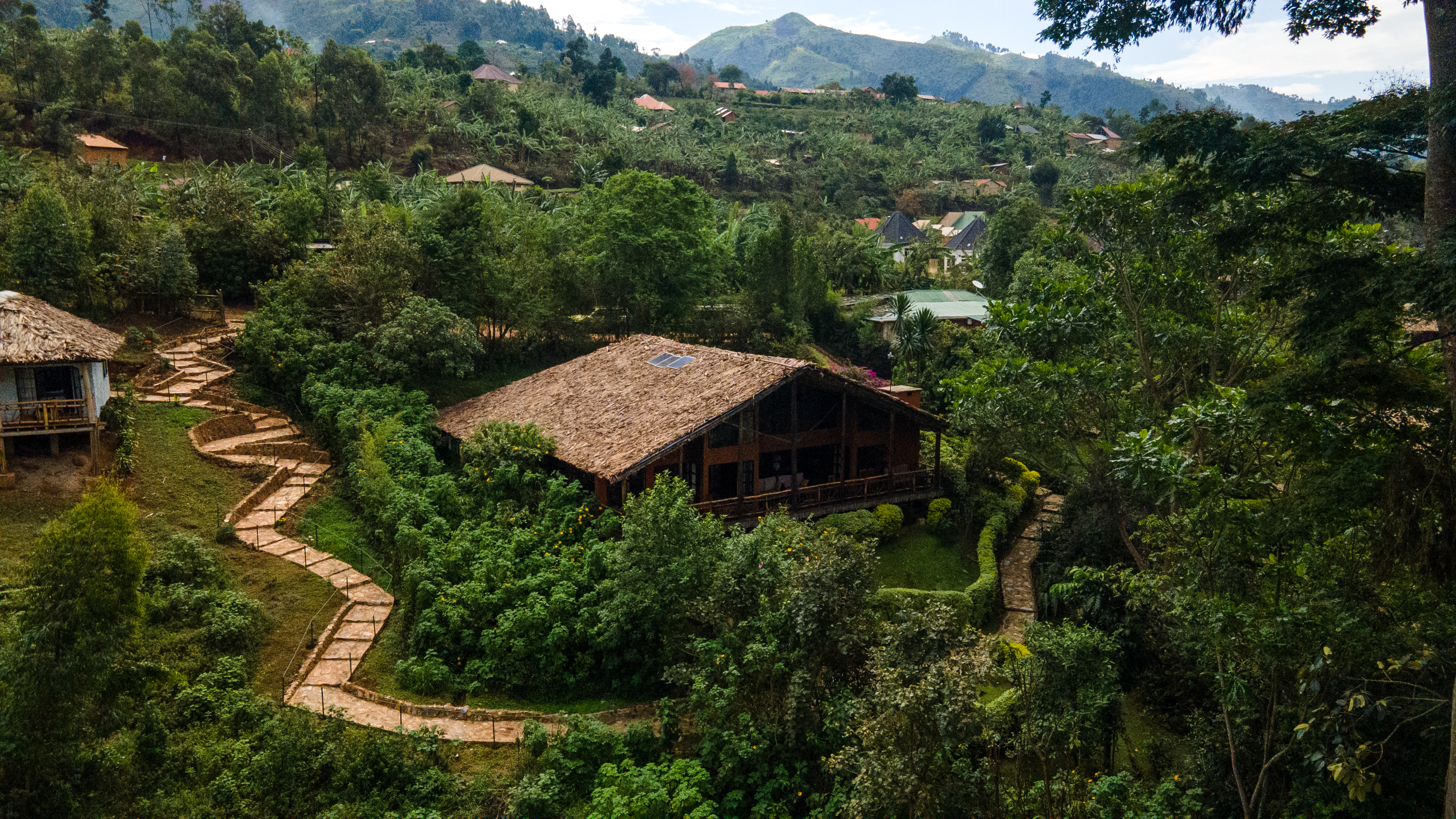 Aerial view of Mahogany Springs Lodge amid lush greenery in Buhoma, Uganda